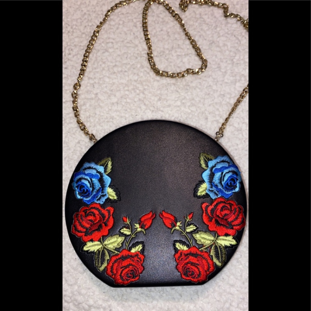 A cross body bag with flower print